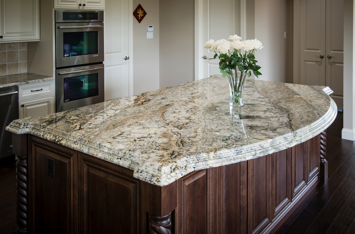 Image of kitchen island with light granite countertop